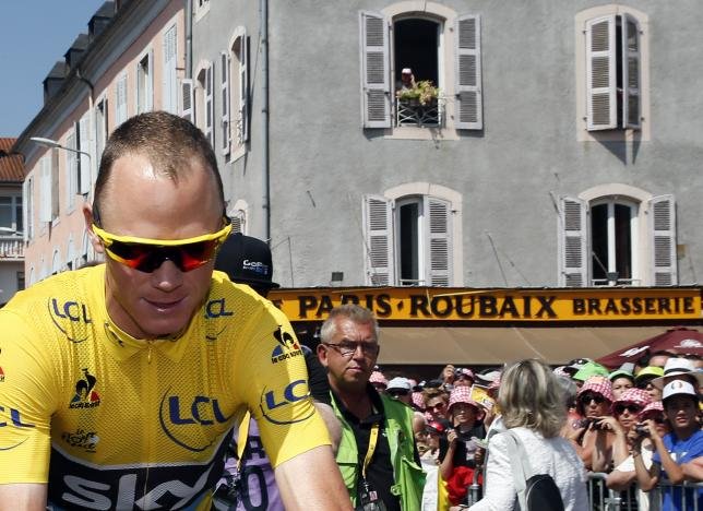 Team Sky rider Chris Froome of Britain, race leader's yellow jersey, arrives before the start of the 167-km (103.7 miles) 10th stage of the 102nd Tour de France cycling race from Tarbes to La Pierre-Saint -Martin, France, July 14, 2015. REUTERS/Benoit Tessier
